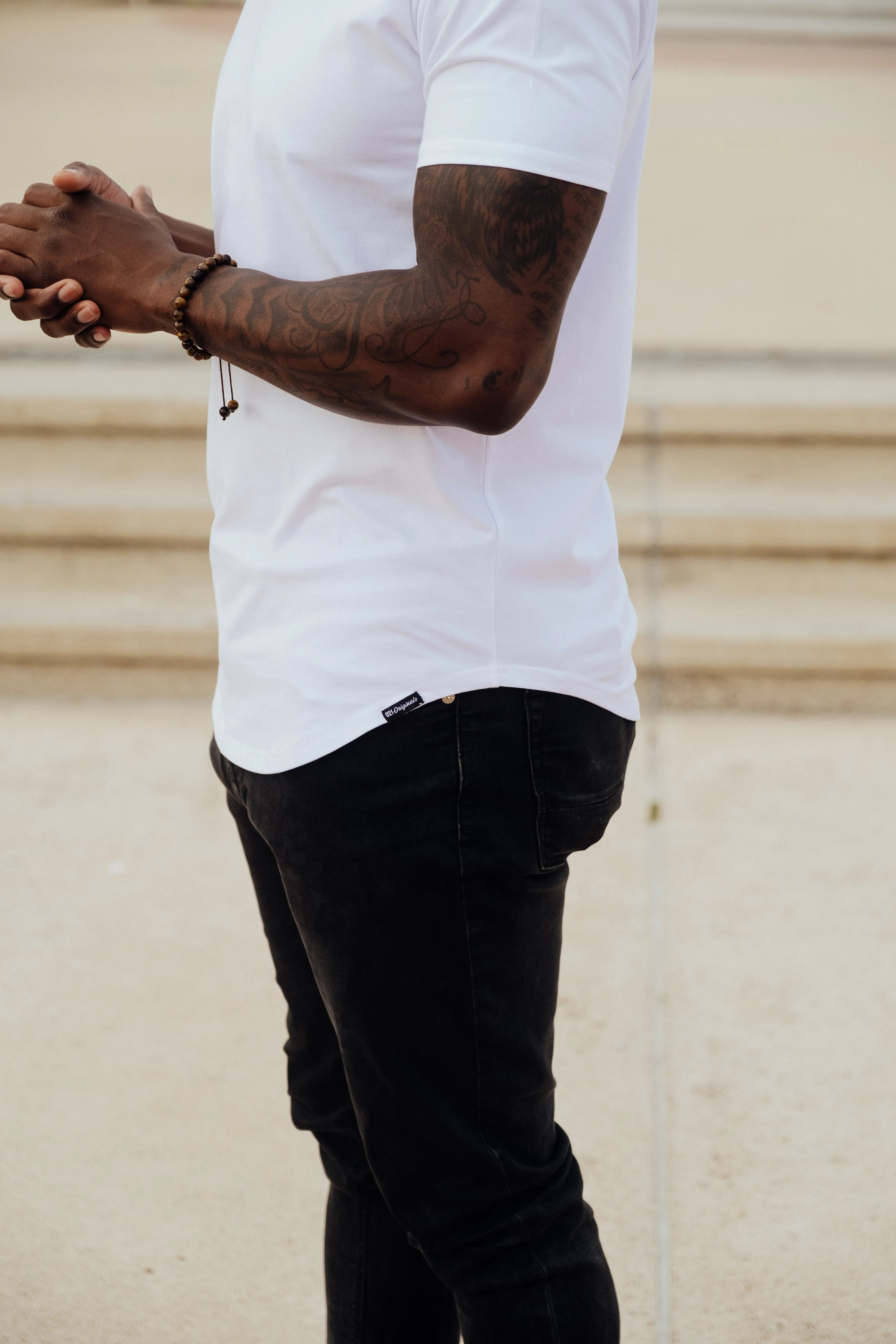 Curved drop-cut hem detail
